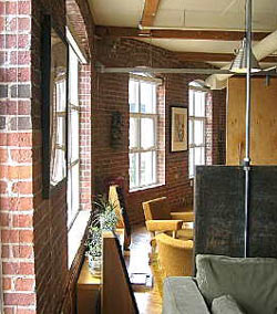 Imperial Lofts in Toronto - exposed brick and wood beams are often found in converted warehouse or factory buildings.