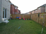 Empty garden gives impression of an unfinished house